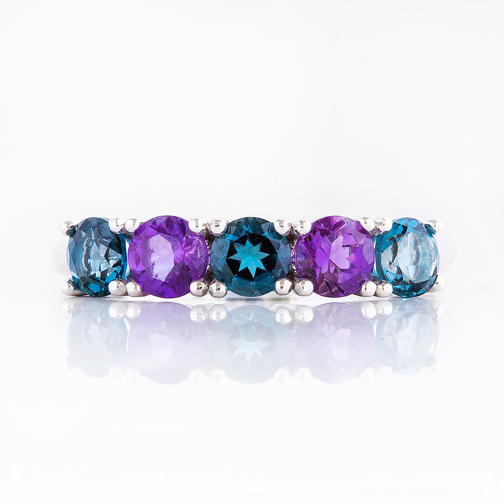 Annie, a London Topaz and Amethyst Half Eternity Ring