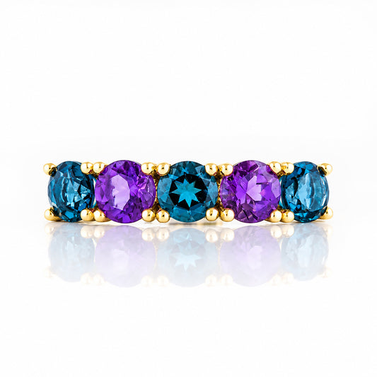 Annie, a London Topaz and Amethyst Half Eternity Ring