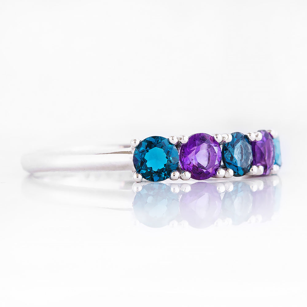 Annie, a London Topaz and Amethyst Half Eternity Ring