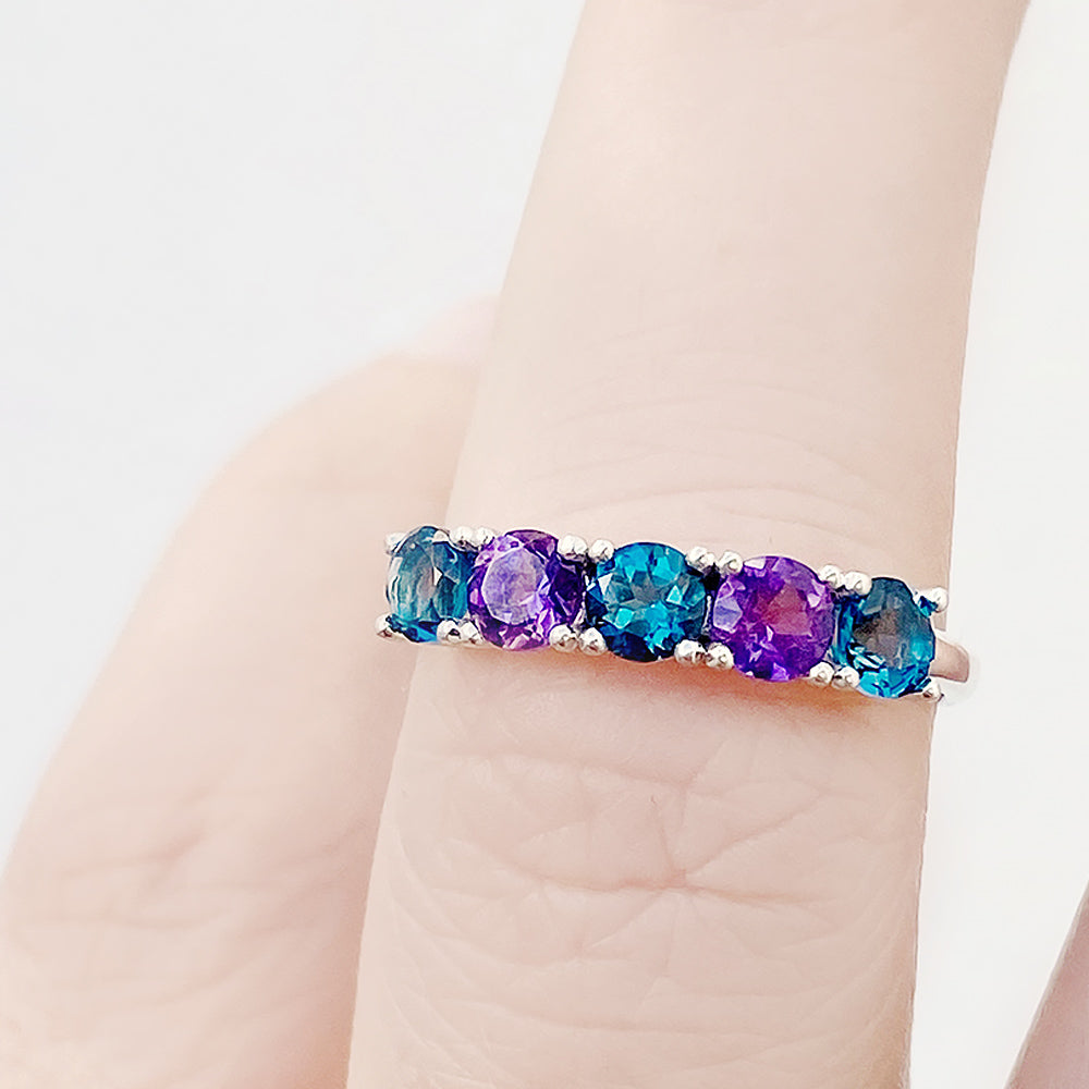 Annie, a London Topaz and Amethyst Half Eternity Ring