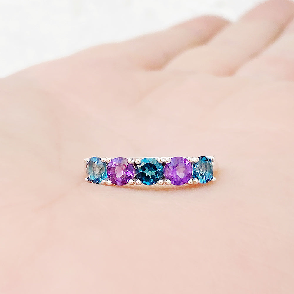 Annie, a London Topaz and Amethyst Half Eternity Ring