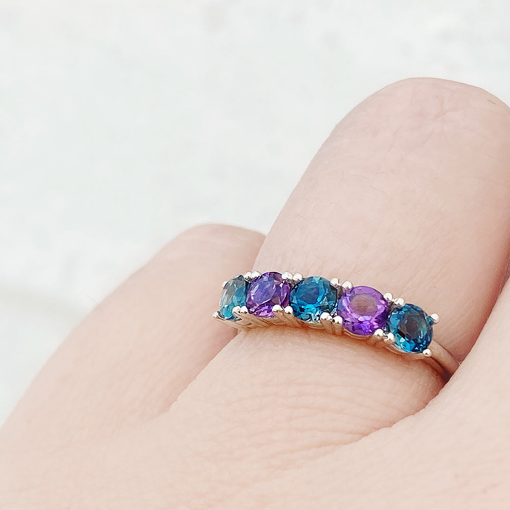 Annie, a London Topaz and Amethyst Half Eternity Ring