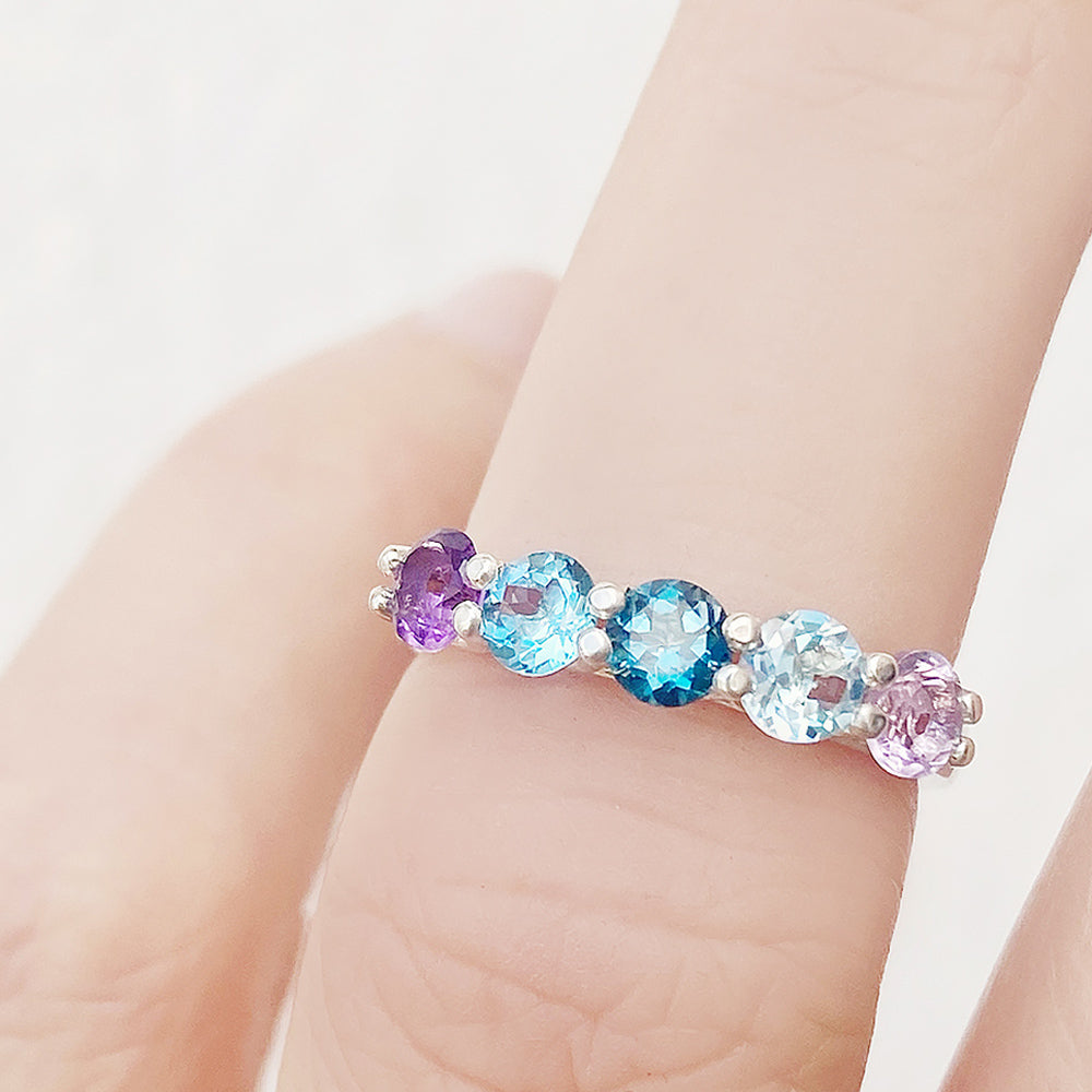 Danelle, a Topaz and Amethyst Rainbow Half Eternity Trellis Ring