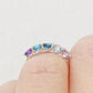 Danelle, a Topaz and Amethyst Rainbow Half Eternity Trellis Ring