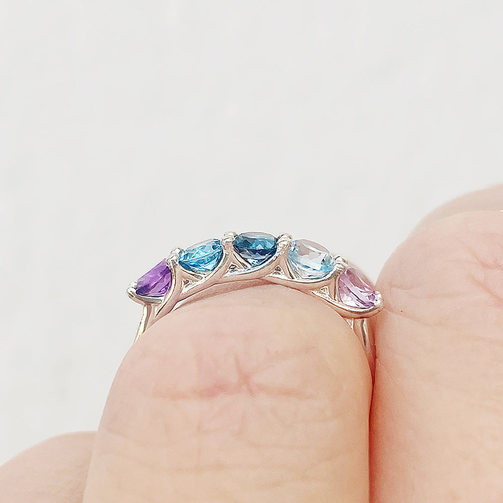 Danelle, a Topaz and Amethyst Rainbow Half Eternity Trellis Ring