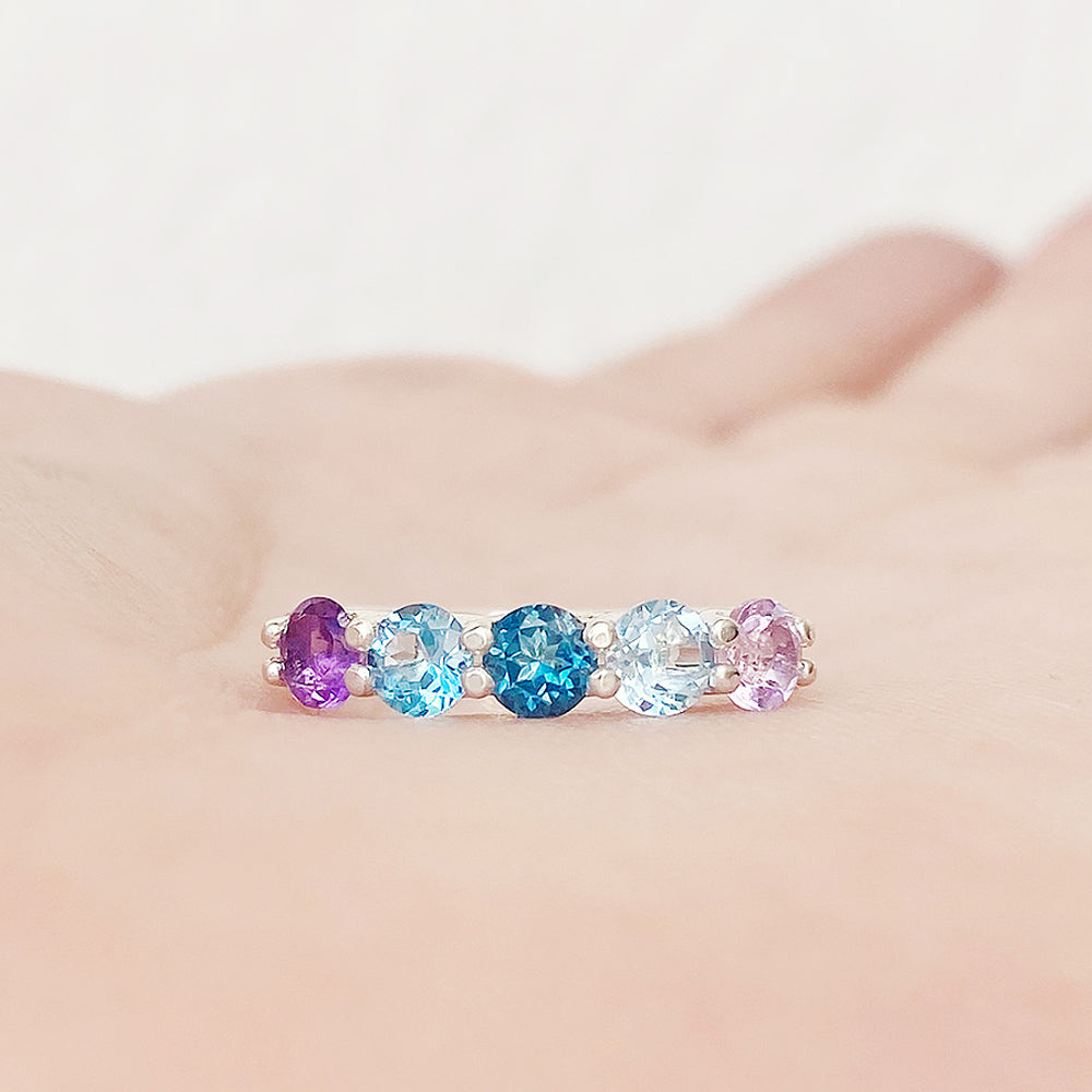 Danelle, a Topaz and Amethyst Rainbow Half Eternity Trellis Ring
