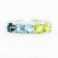 Annie, a Topaz and Peridot Half Eternity Ring