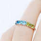 Annie, a Topaz and Peridot Half Eternity Ring