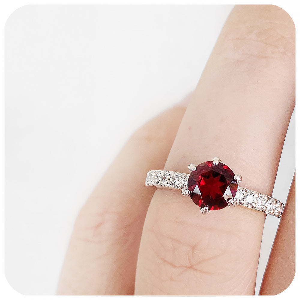 brilliant cut garnet and cubic accent engagement ring