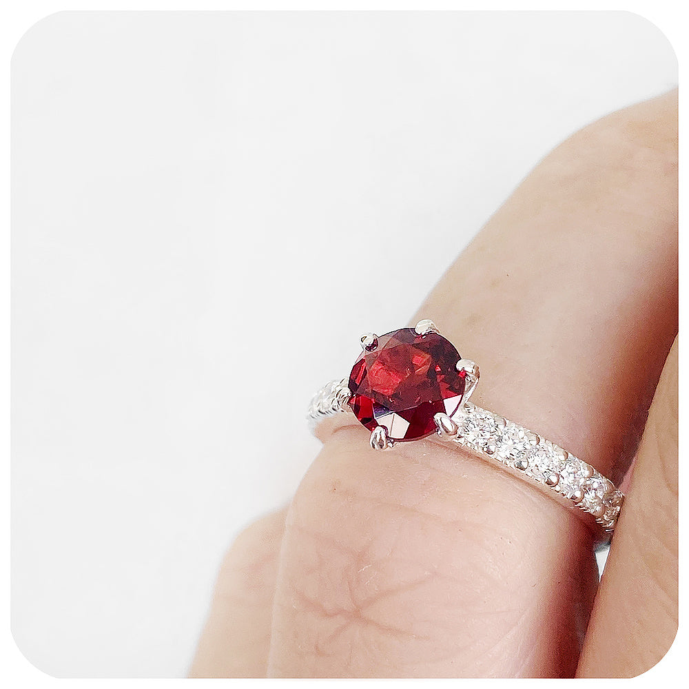 brilliant cut garnet and cubic accent engagement ring