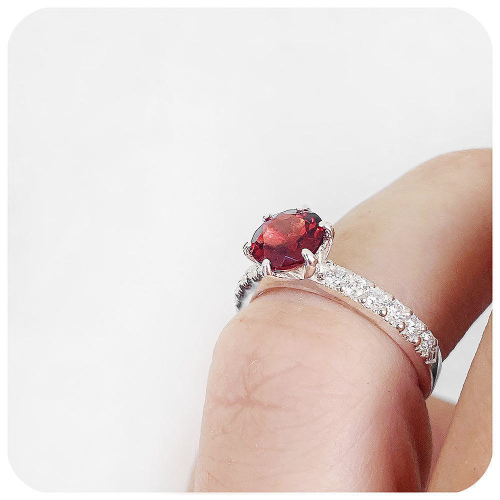 brilliant cut garnet and cubic accent engagement ring