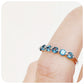 teal london blue topaz half eternity stack ring with shared claws