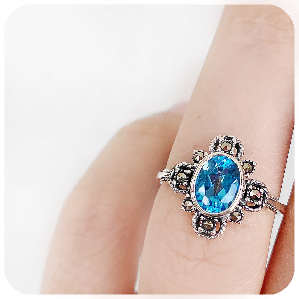 oval cut blue topaz ring in a vintage rope design setting