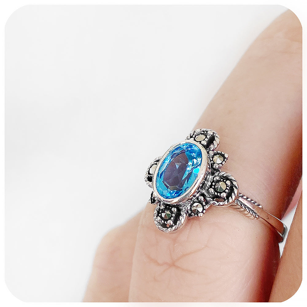 oval cut blue topaz ring in a vintage rope design setting