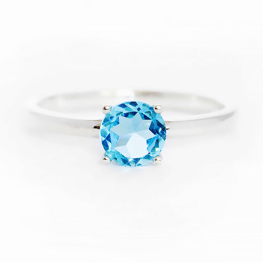 Lina, a Round cut Swiss Blue Topaz Solitaire Ring - Victoria's Jewellery