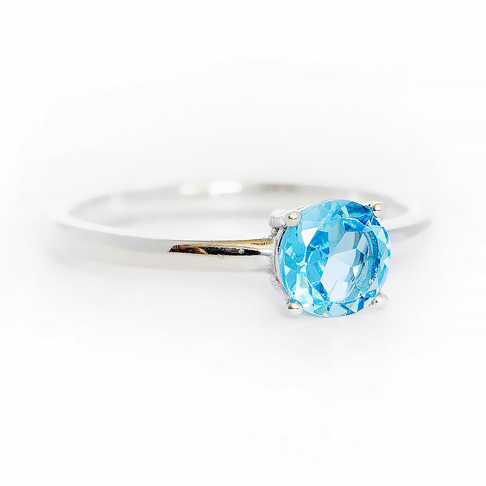 Lina, a Round cut Swiss Blue Topaz Solitaire Ring - Victoria's Jewellery