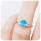 Serena, a Swiss and Sky Blue Topaz Trilogy Ring