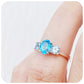 Serena, a Swiss and Sky Blue Topaz Trilogy Ring