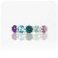 Danelle, a Topaz and Amethyst Rainbow Half Eternity Trellis Ring