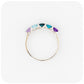 Danelle, a Topaz and Amethyst Rainbow Half Eternity Trellis Ring