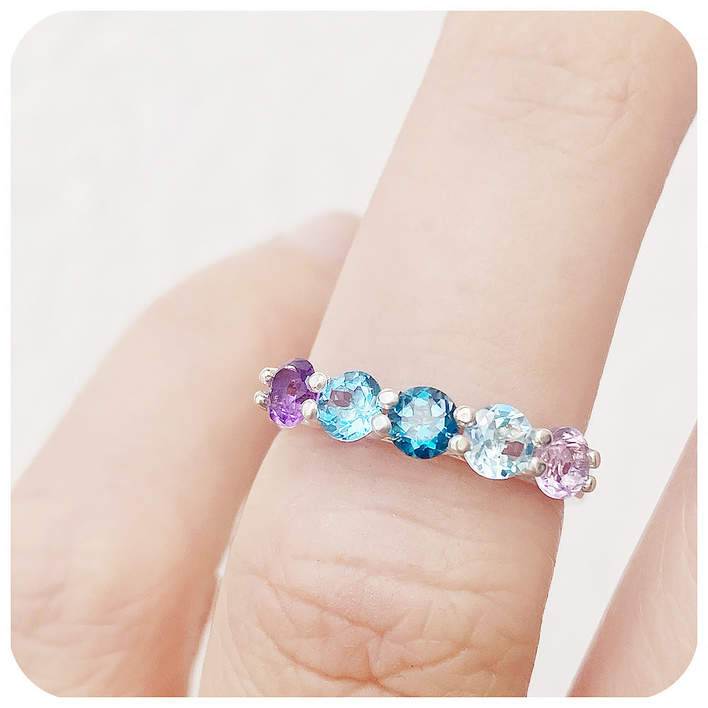 Danelle, a Topaz and Amethyst Rainbow Half Eternity Trellis Ring