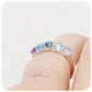 Danelle, a Topaz and Amethyst Rainbow Half Eternity Trellis Ring