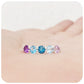 Danelle, a Topaz and Amethyst Rainbow Half Eternity Trellis Ring