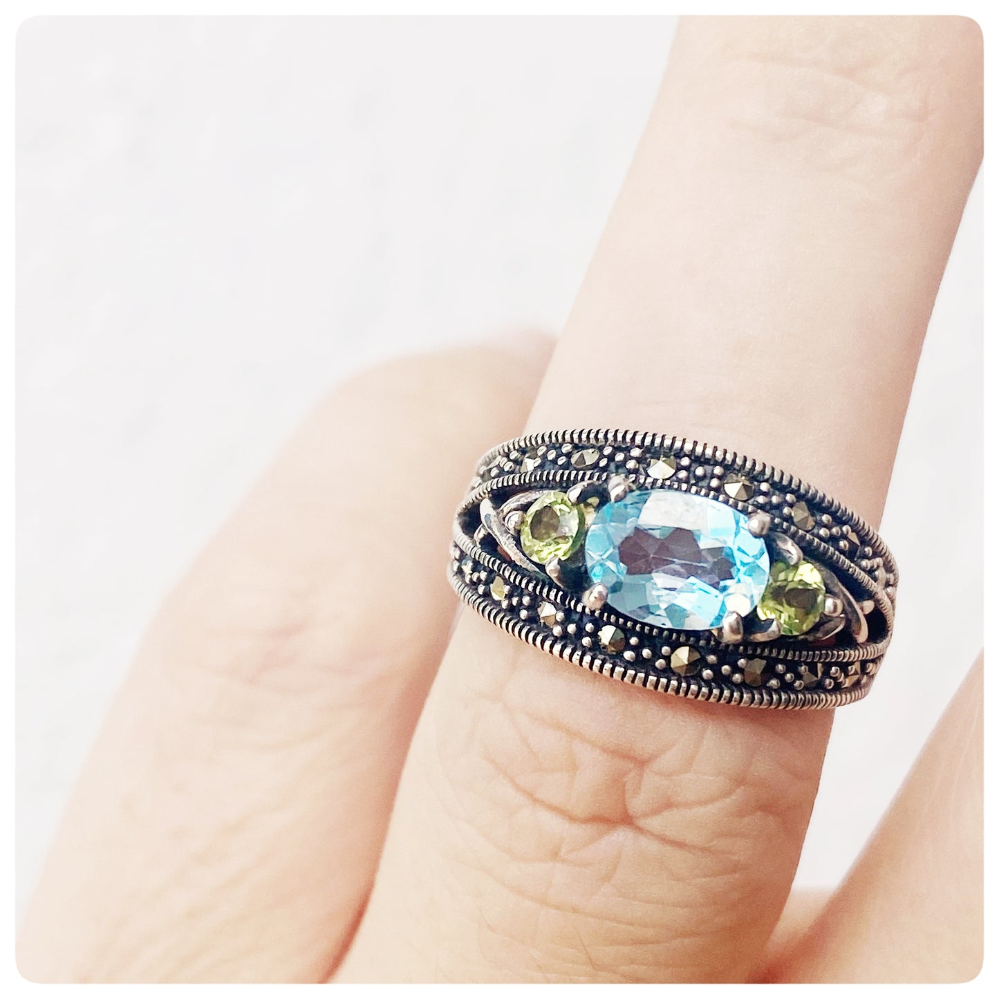 peridot and blue topaz vintage style trilogy ring