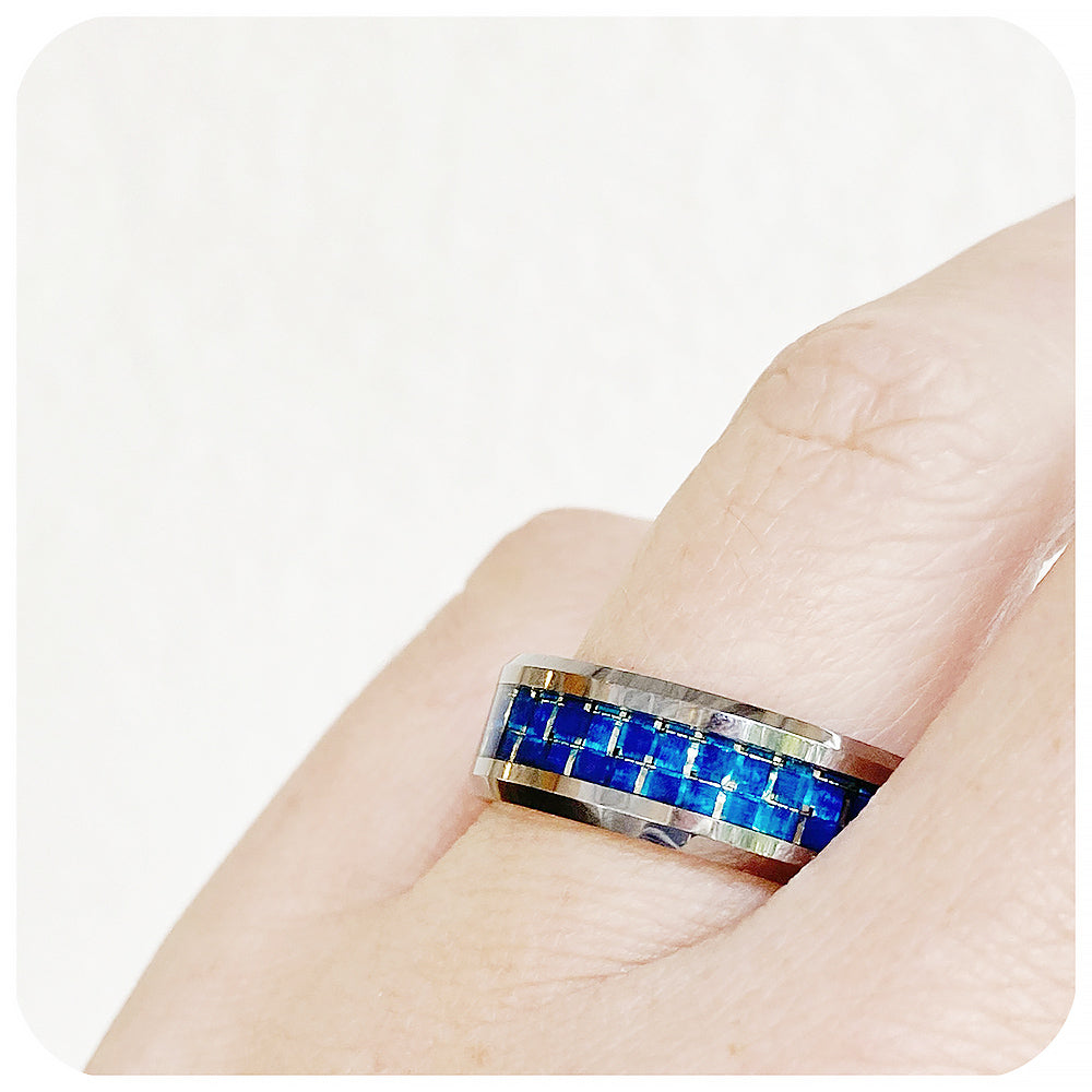 Jaxson, a Polished Tungsten Men's Ring with Dark Blue Carbon Fiber Inlay - 8mm