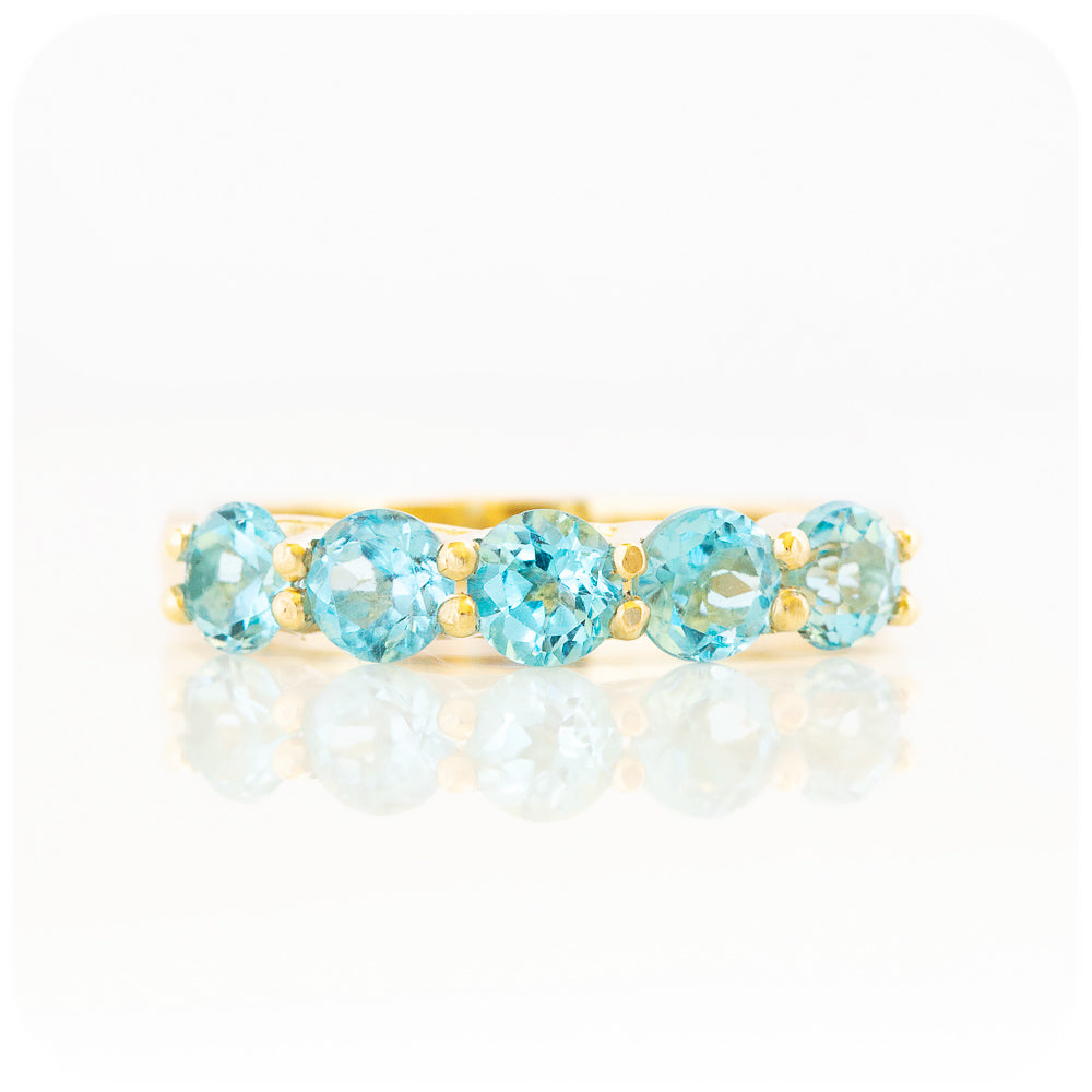 Danelle, a Swiss Blue Topaz Half Eternity Trellis Ring