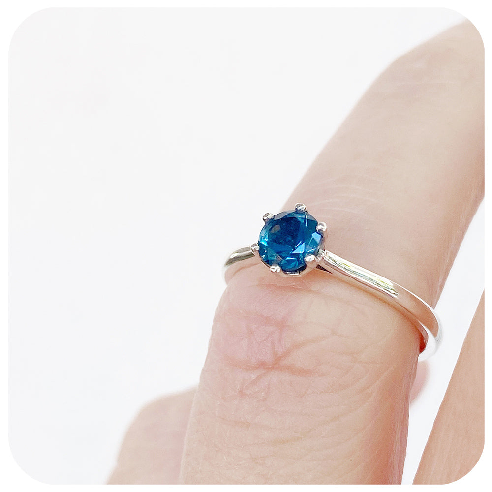 Tulip, a Six Claw London Blue Topaz Ring
