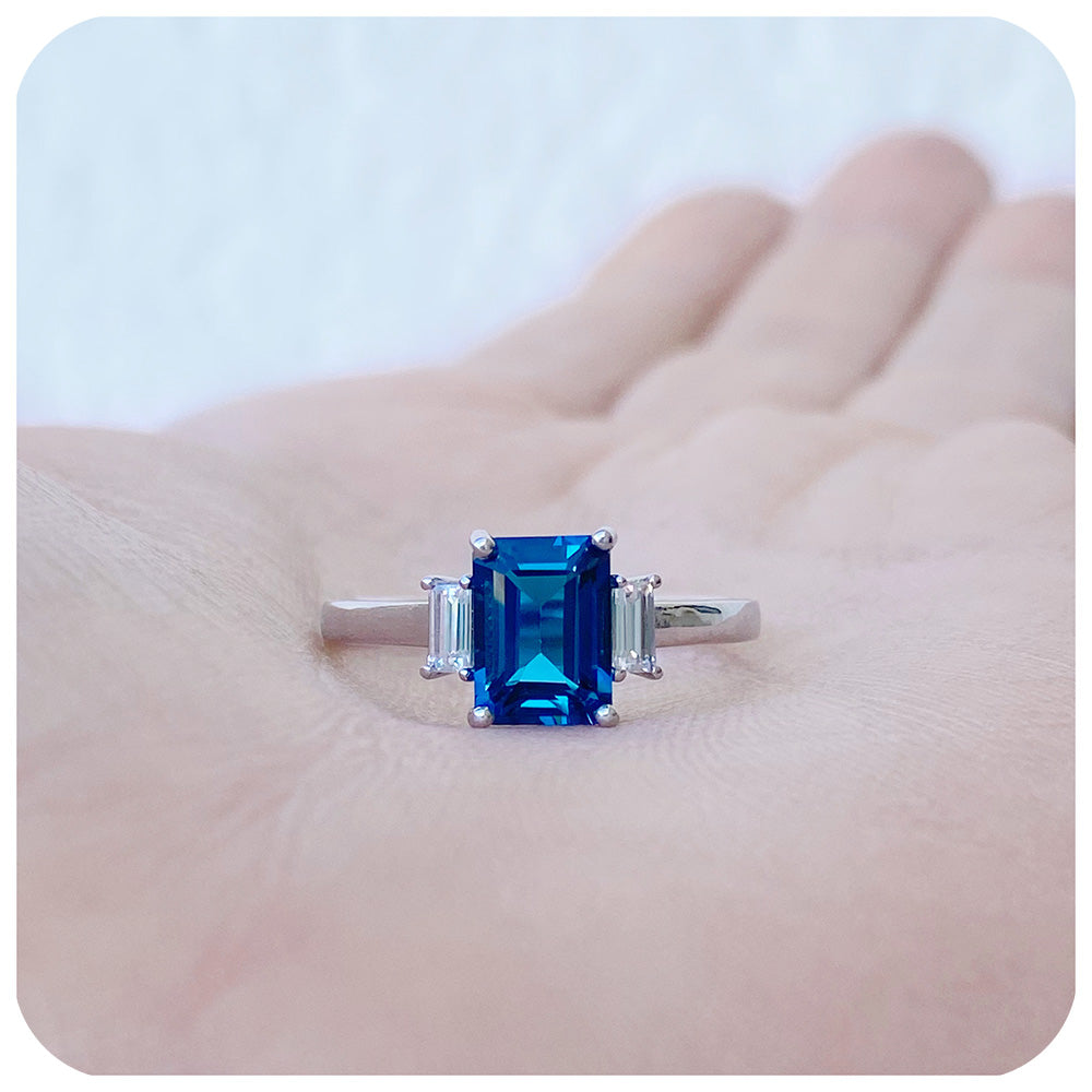 Lisa, Emerald cut London Blue Topaz and Moissanite Engagement Ring