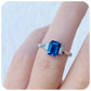 Lisa, Emerald cut London Blue Topaz and Moissanite Engagement Ring