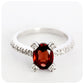 Oval Cut Garnet Ring in Sterling Silver with Cubic Zirconia Detail - Victoria's Jewellery