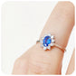 Eva, a Blue Sapphire and Moissanite Halo Ring