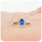 Eva, a Blue Sapphire and Moissanite Halo Ring