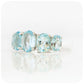 oval cut graduated sky blue topaz half eternity anniversary or birthstone ring