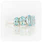 oval cut graduated sky blue topaz half eternity anniversary or birthstone ring