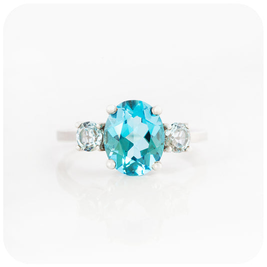 Oval cut Swiss Blue and Sky Blue Topaz Trilogy Ring