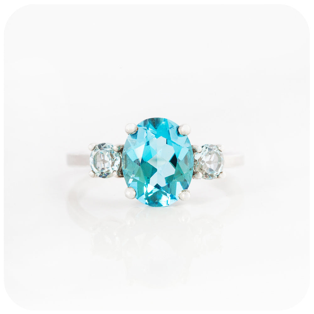 Oval cut Swiss Blue Topaz and Sky Blue Topaz Trilogy Anniversary Ring - Victoria's Jewellery