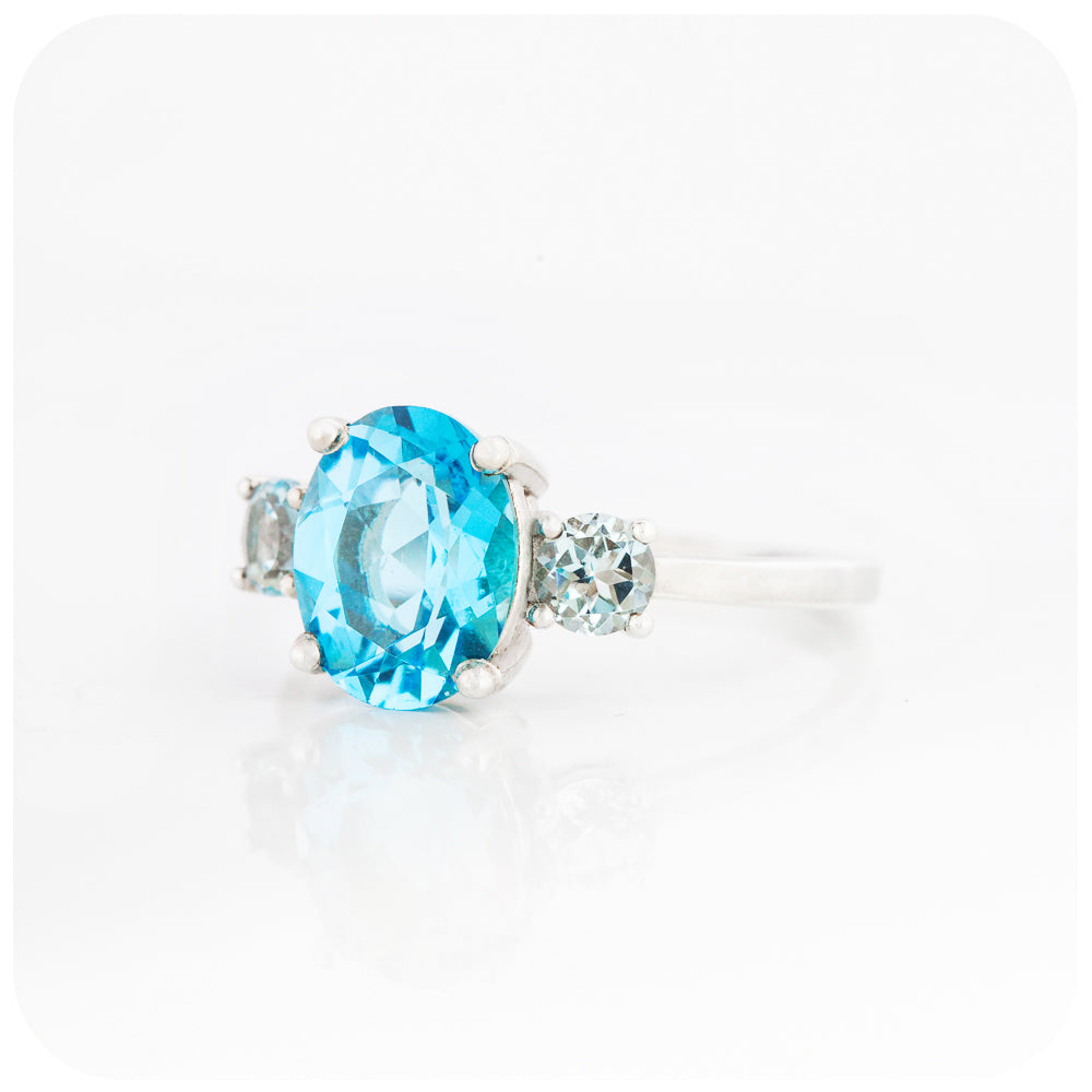 Oval cut Swiss Blue Topaz and Sky Blue Topaz Trilogy Anniversary Ring - Victoria's Jewellery