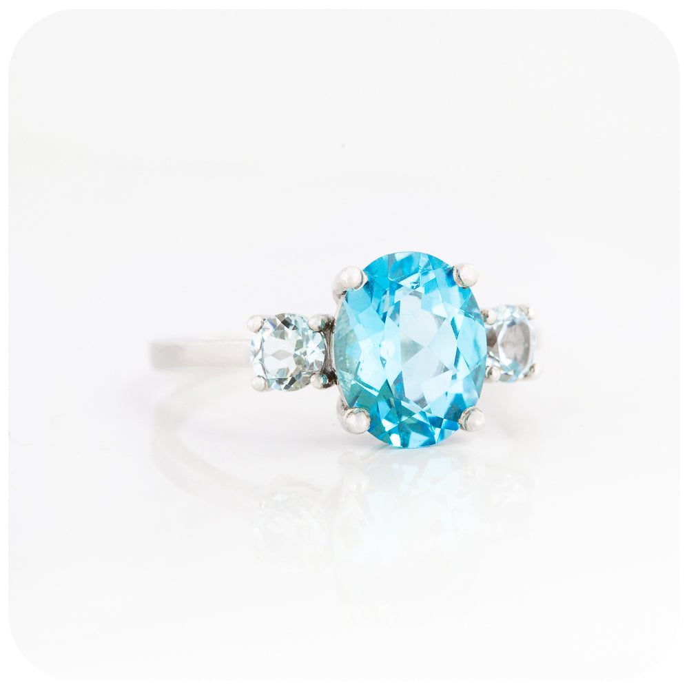 Oval cut Swiss Blue Topaz and Sky Blue Topaz Trilogy Anniversary Ring - Victoria's Jewellery