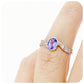 oval cut tanzanite and cubic zirconia twisted band ring in sterling silver