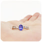 oval cut tanzanite and cubic zirconia twisted band ring in sterling silver