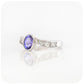 oval cut tanzanite and cubic zirconia twisted band ring in sterling silver