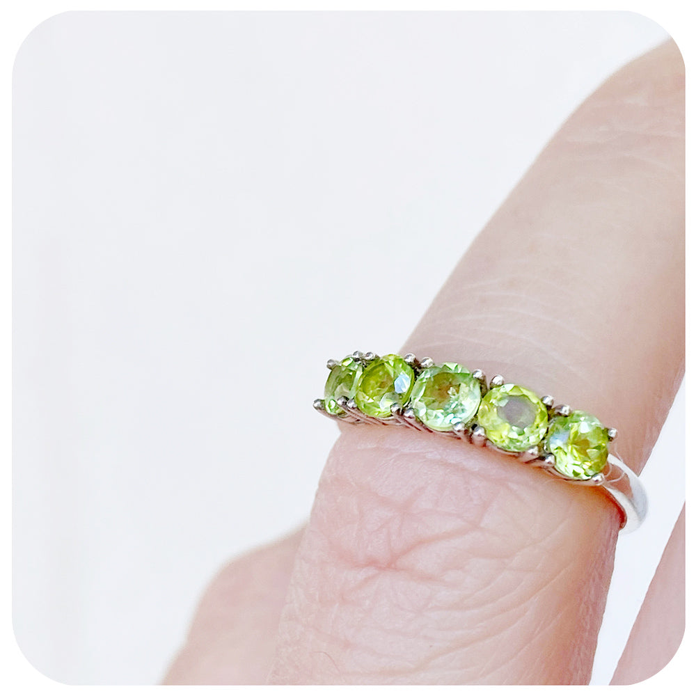 round cut green peridot half eternity anniversary ring