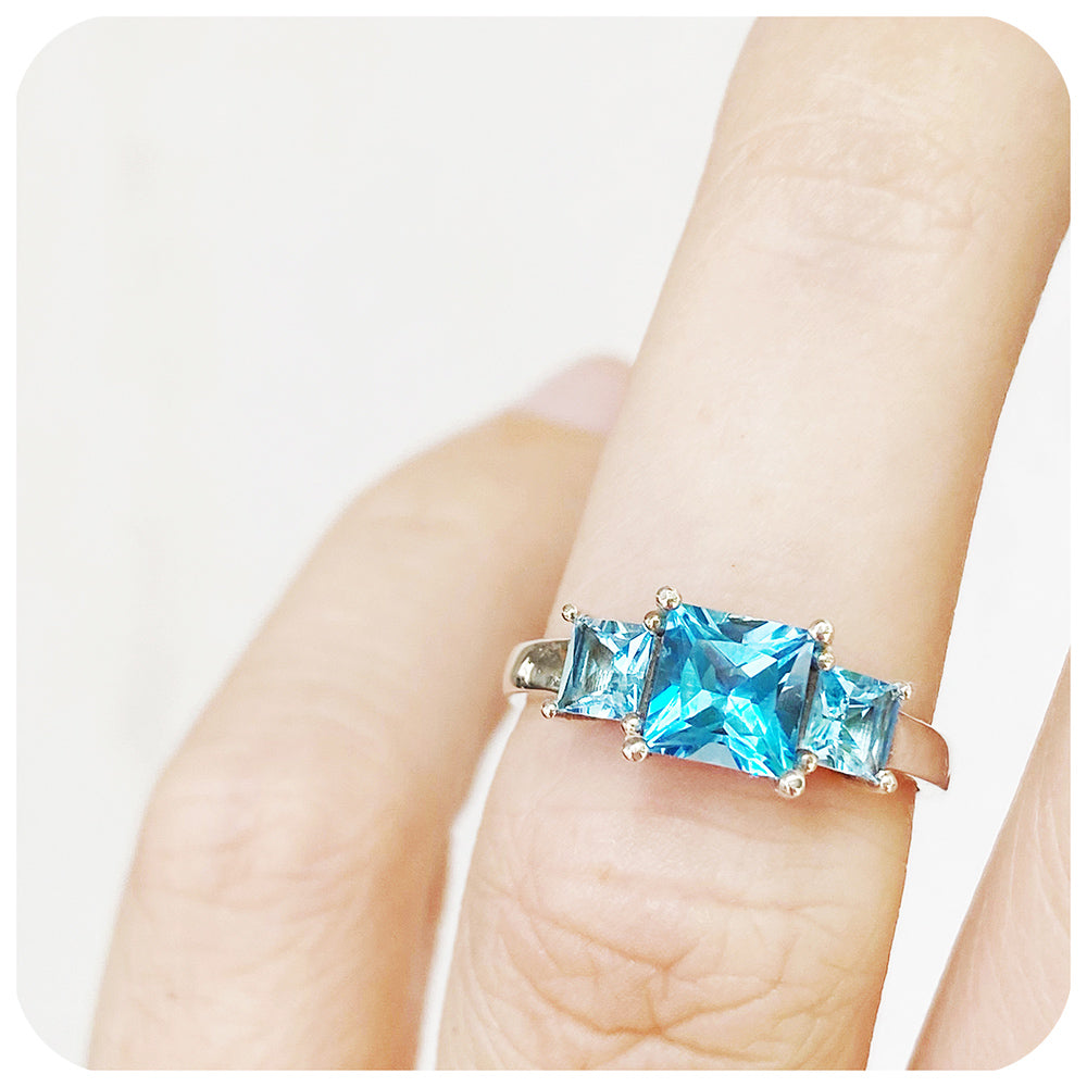 Princess cut Swiss Blue Topaz Trilogy Ring in Sterling Silver