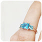 Princess cut Swiss Blue Topaz Trilogy Ring in Sterling Silver