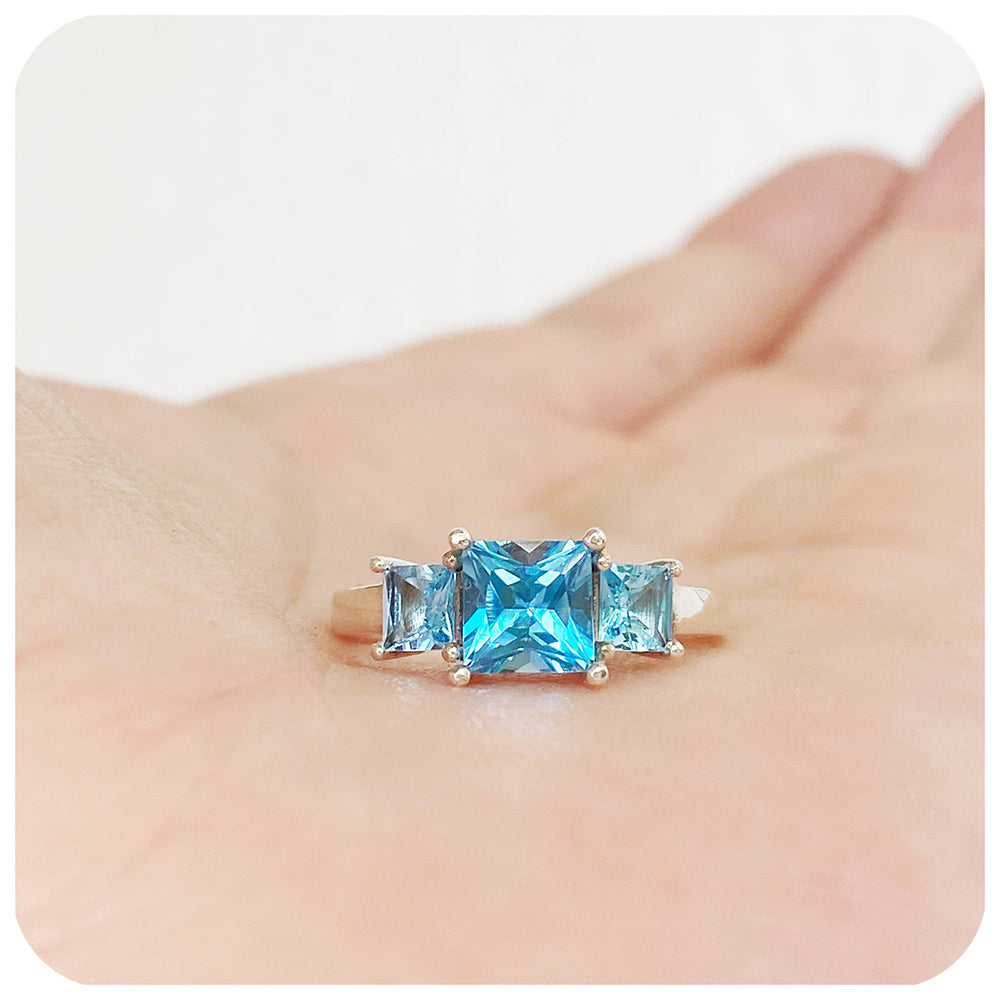 Princess cut Swiss Blue Topaz Trilogy Ring in Sterling Silver