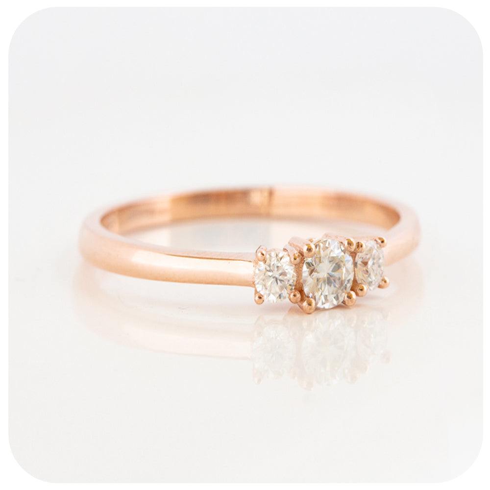 brilliant round cut moissanite trilogy engagement ring in rose gold - Victoria's Jewellery